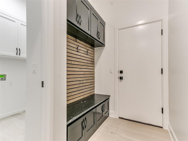 mudroom with light hardwood / wood-style flooring