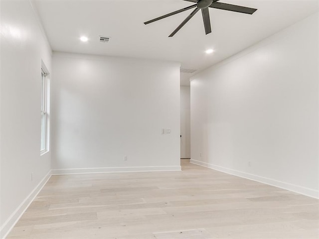 spare room featuring ceiling fan and light hardwood / wood-style flooring