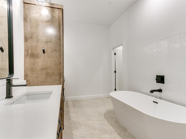 bathroom featuring a tub and vanity