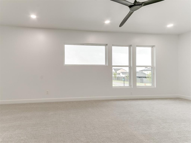 carpeted empty room with ceiling fan