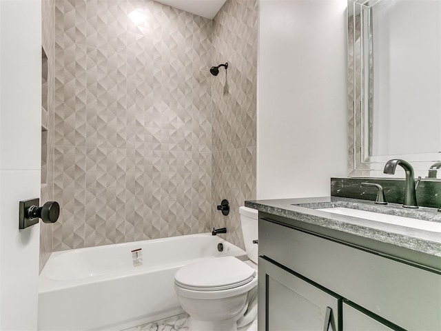 full bathroom featuring toilet, vanity, and tiled shower / bath