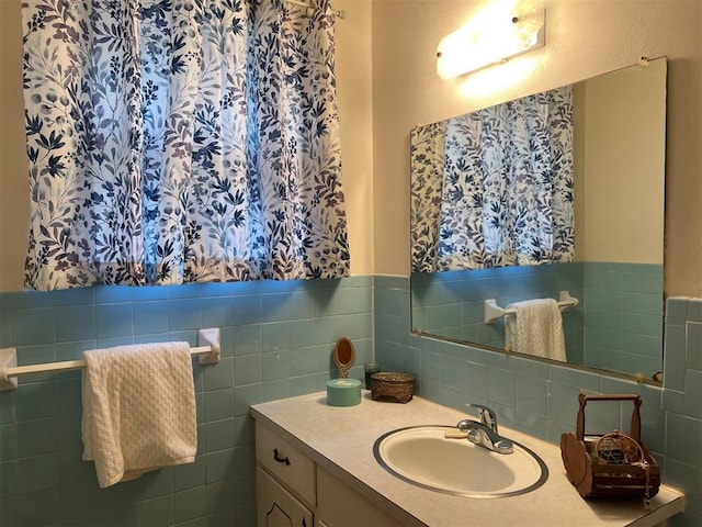 bathroom with tile walls and vanity