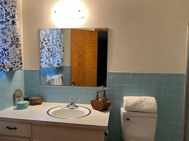 bathroom with toilet and vanity