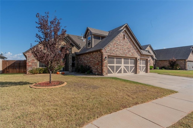 view of front of property with a front lawn and a garage