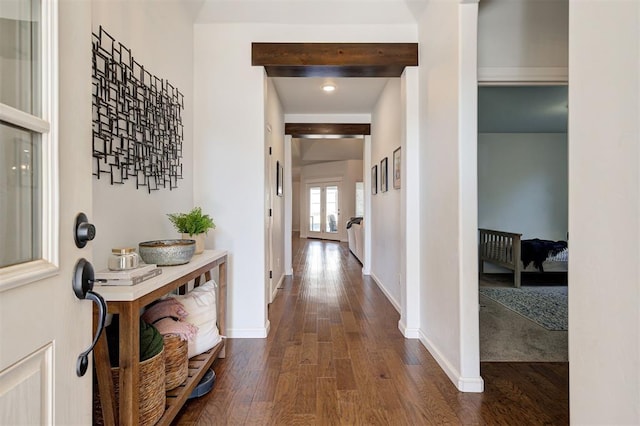 hall with beam ceiling and dark hardwood / wood-style flooring