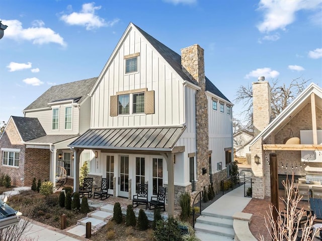 rear view of property with a patio and french doors