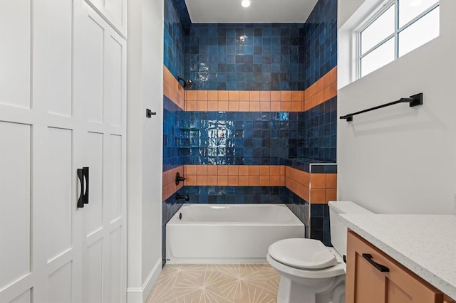 full bathroom featuring toilet, shower / washtub combination, tile patterned flooring, and vanity