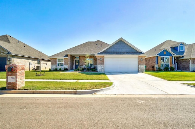 view of front of house with a garage and a front lawn