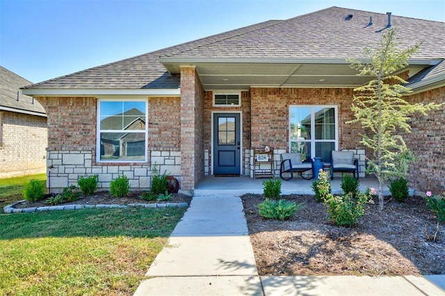 doorway to property with a lawn, a patio area, and an outdoor living space