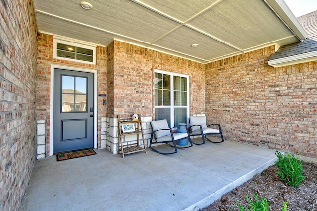 entrance to property with a patio