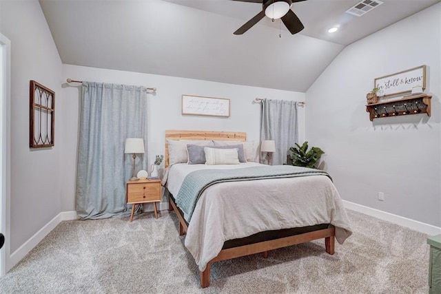 bedroom with ceiling fan, lofted ceiling, and carpet flooring