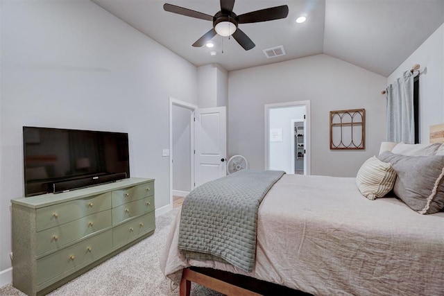 carpeted bedroom with ceiling fan and vaulted ceiling