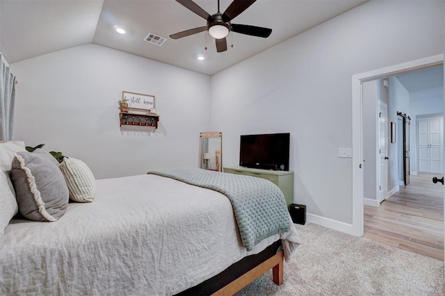 bedroom featuring ceiling fan and lofted ceiling