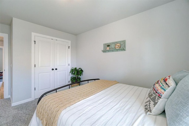 bedroom featuring a closet and carpet flooring