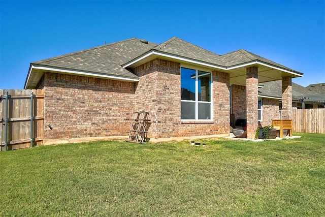 back of house with a yard