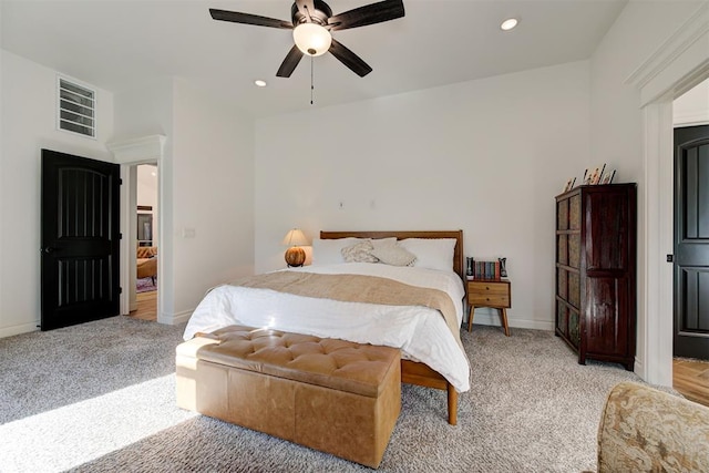 bedroom with light colored carpet and ceiling fan