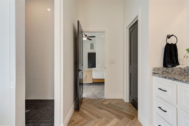 corridor with light parquet floors