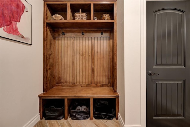 mudroom with light hardwood / wood-style floors