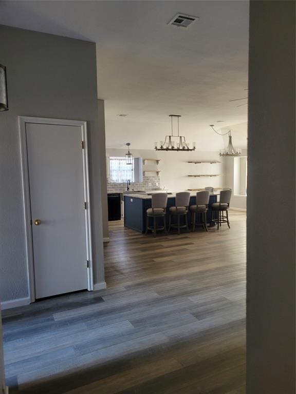 unfurnished dining area featuring wood-type flooring