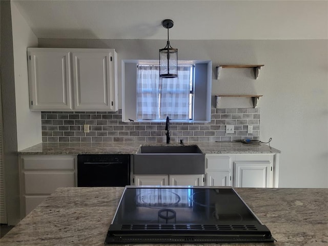 kitchen featuring decorative light fixtures, white cabinetry, and decorative backsplash