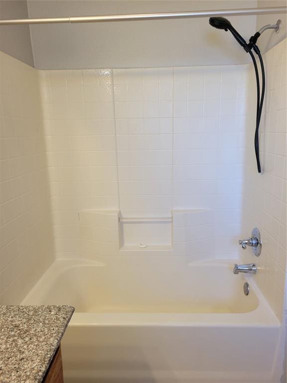 bathroom with shower / bathing tub combination and vanity