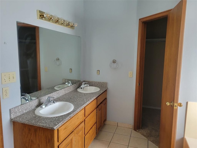 bathroom with tile patterned flooring and vanity