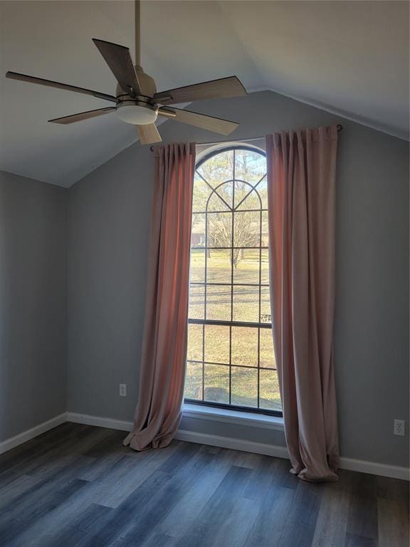 interior space featuring vaulted ceiling, ceiling fan, and dark hardwood / wood-style floors