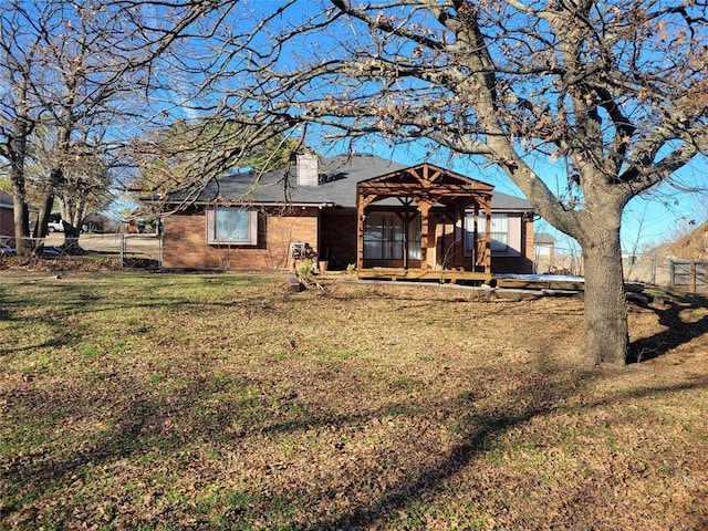 view of front facade with a gazebo and a front yard