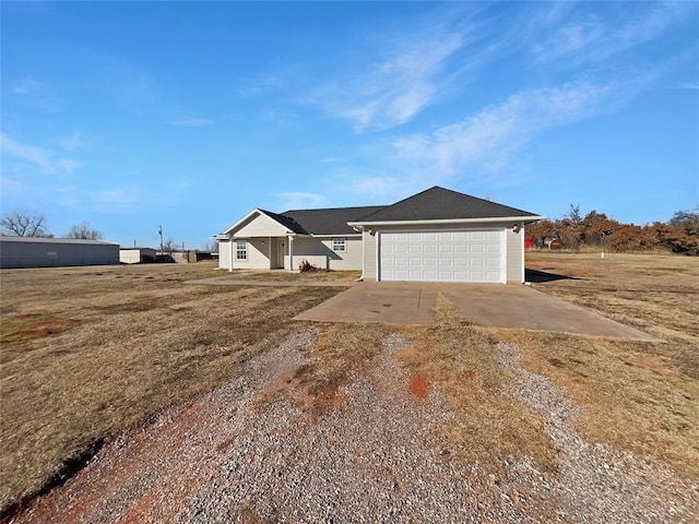 ranch-style home with a front lawn and a garage