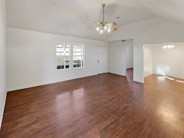 spare room with ceiling fan, vaulted ceiling, and dark hardwood / wood-style floors