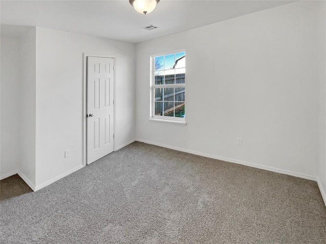 empty room featuring carpet flooring