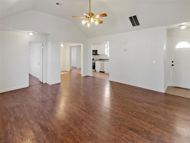 unfurnished living room featuring dark wood-type flooring, lofted ceiling, and ceiling fan