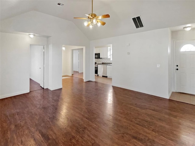 unfurnished living room featuring ceiling fan, dark wood-type flooring, and lofted ceiling