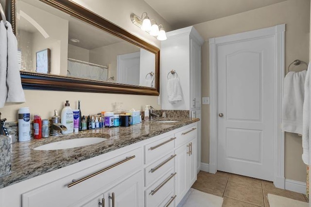 bathroom with tile patterned flooring and vanity