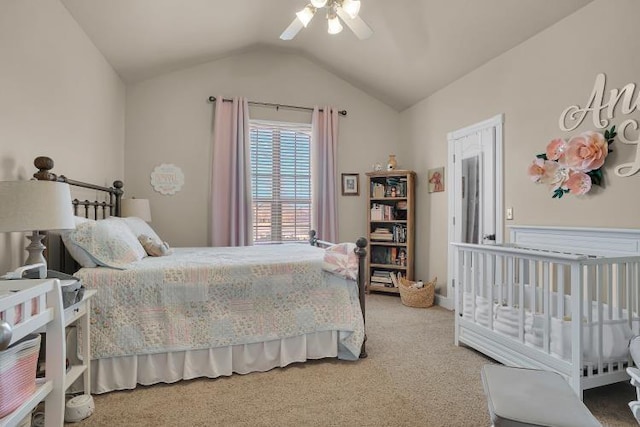 carpeted bedroom featuring vaulted ceiling and ceiling fan