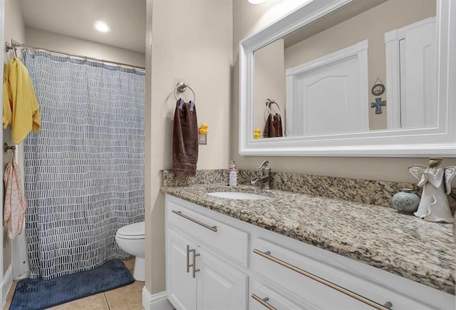 bathroom with walk in shower, vanity, toilet, and tile patterned flooring