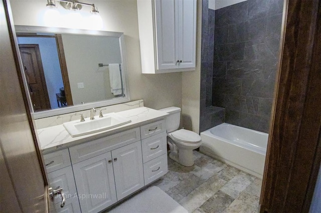 full bathroom with tiled shower / bath combo, toilet, and vanity