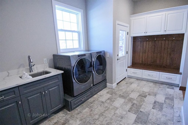 laundry room with sink, cabinets, and washing machine and dryer