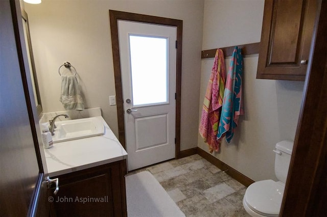 bathroom with toilet and vanity