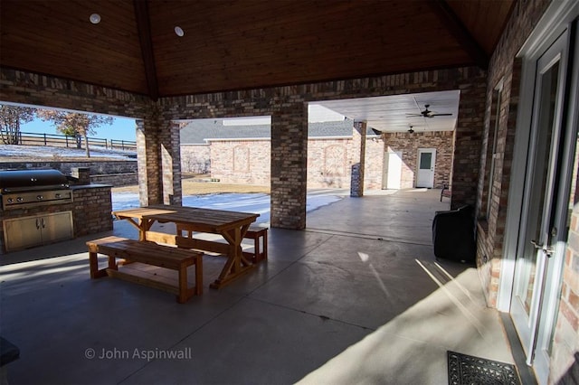 view of patio / terrace with ceiling fan, an outdoor kitchen, a gazebo, and area for grilling