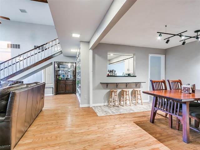 dining space with light hardwood / wood-style flooring