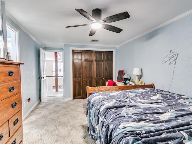 bedroom featuring ceiling fan, a closet, and ornamental molding