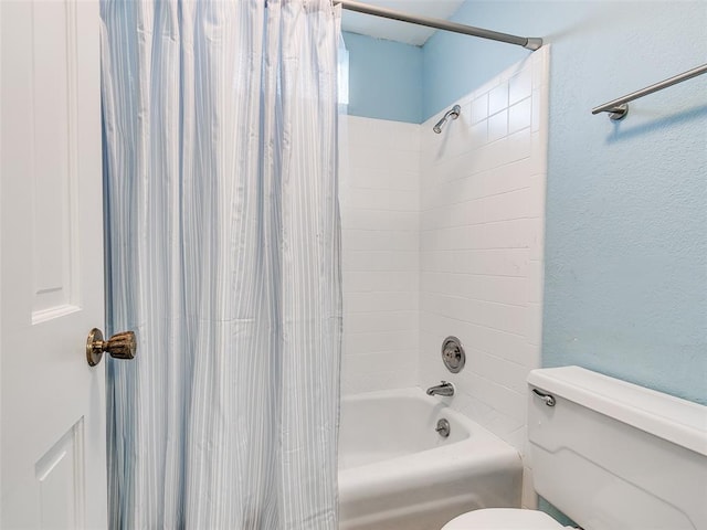 bathroom featuring toilet and shower / bath combo