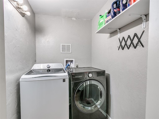 laundry area featuring washing machine and dryer