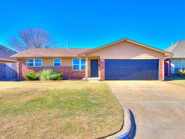 single story home featuring a garage and a front lawn