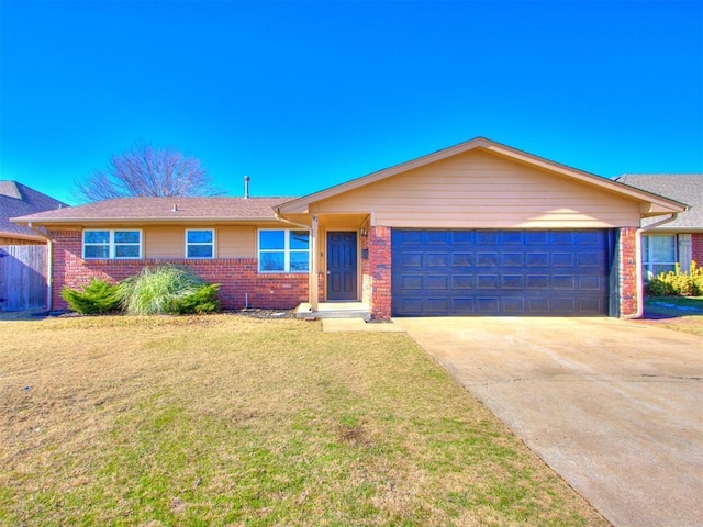 ranch-style home with a front lawn and a garage