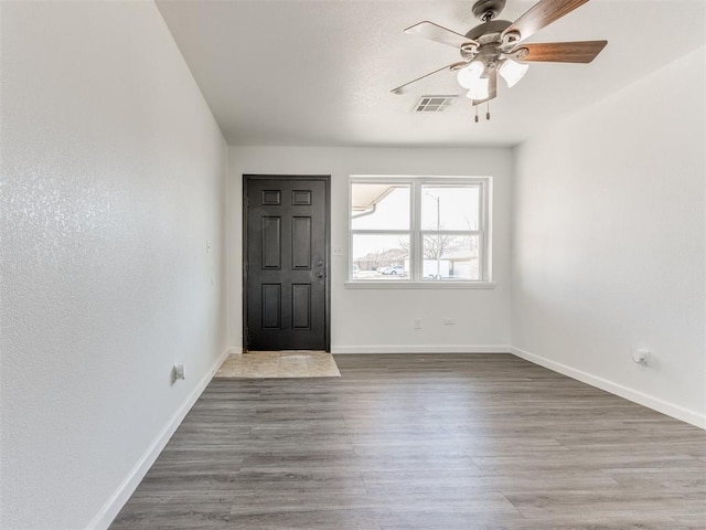 foyer entrance featuring ceiling fan and hardwood / wood-style floors