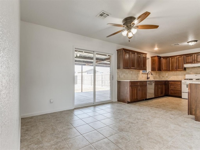 kitchen featuring ceiling fan, backsplash, dishwasher, white range with gas cooktop, and light tile patterned floors