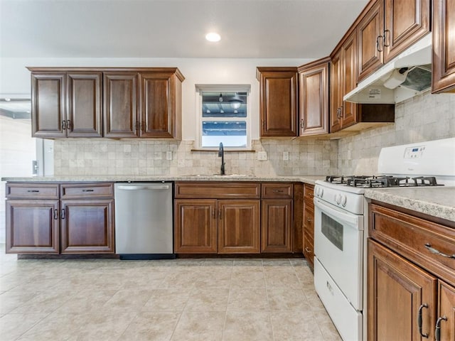 kitchen featuring light stone countertops, white range with gas cooktop, decorative backsplash, sink, and stainless steel dishwasher