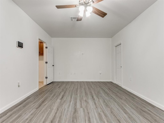 unfurnished room with ceiling fan and light hardwood / wood-style flooring